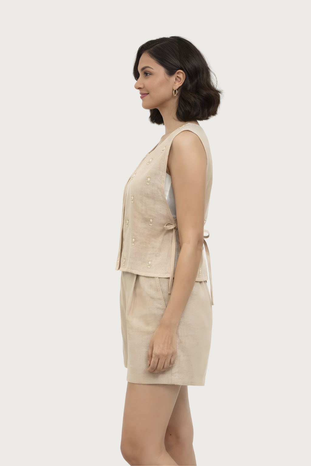 Elegant beige cotton sleeveless top with subtle embroidery for women