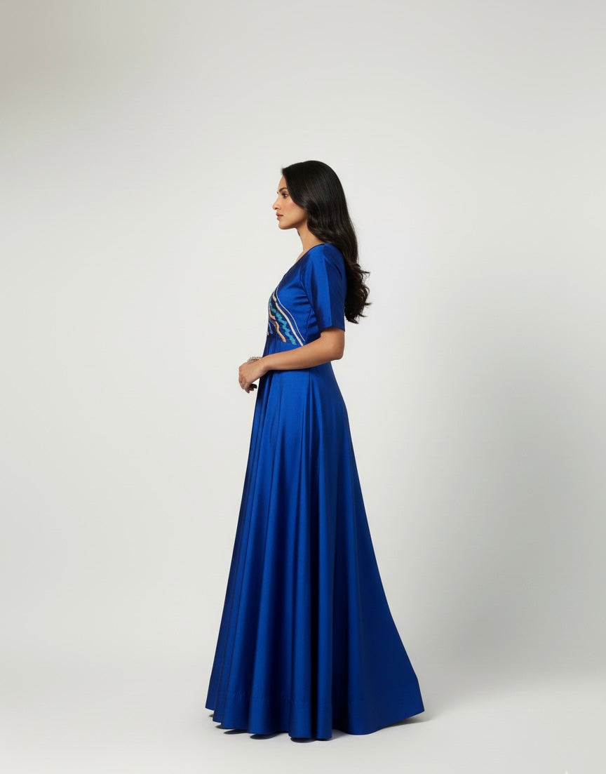 Woman wearing a blue dress with a white background