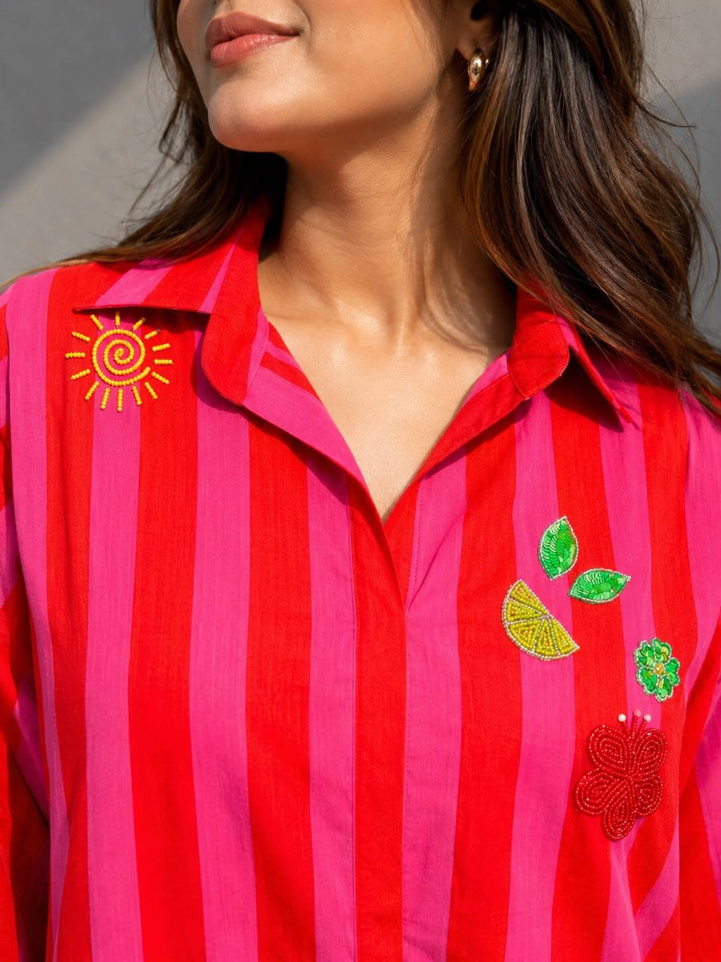 Breathable cotton striped shirt dress with artisanal embellishments, perfect for summer vacations and brunches.