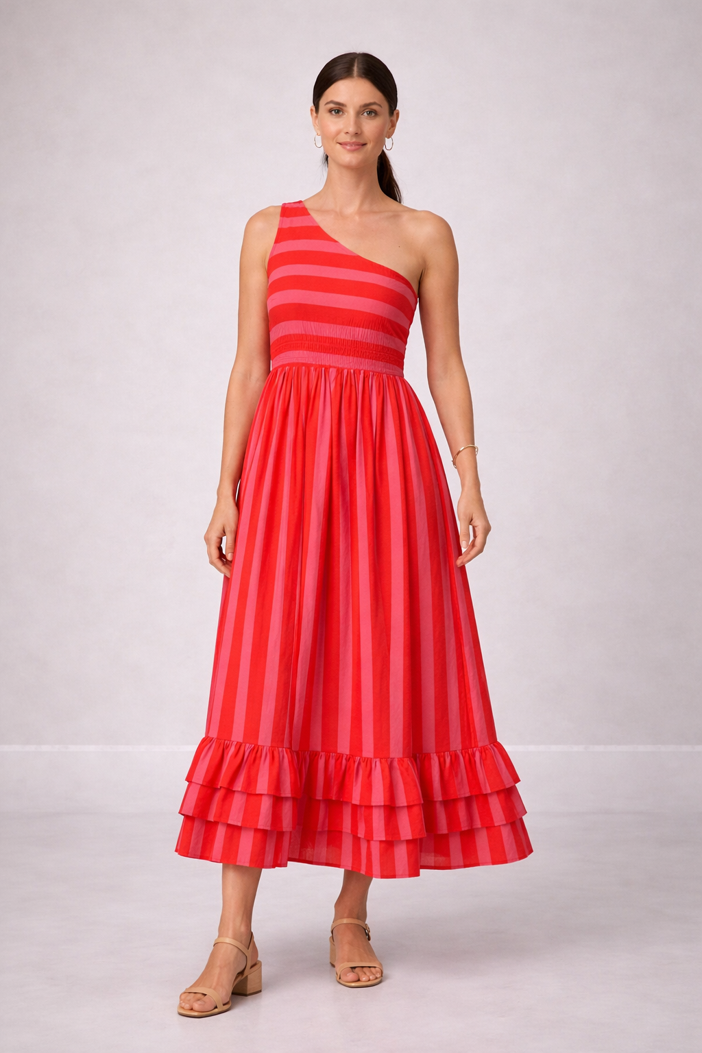 Woman wearing a Pink striped dress on a white background