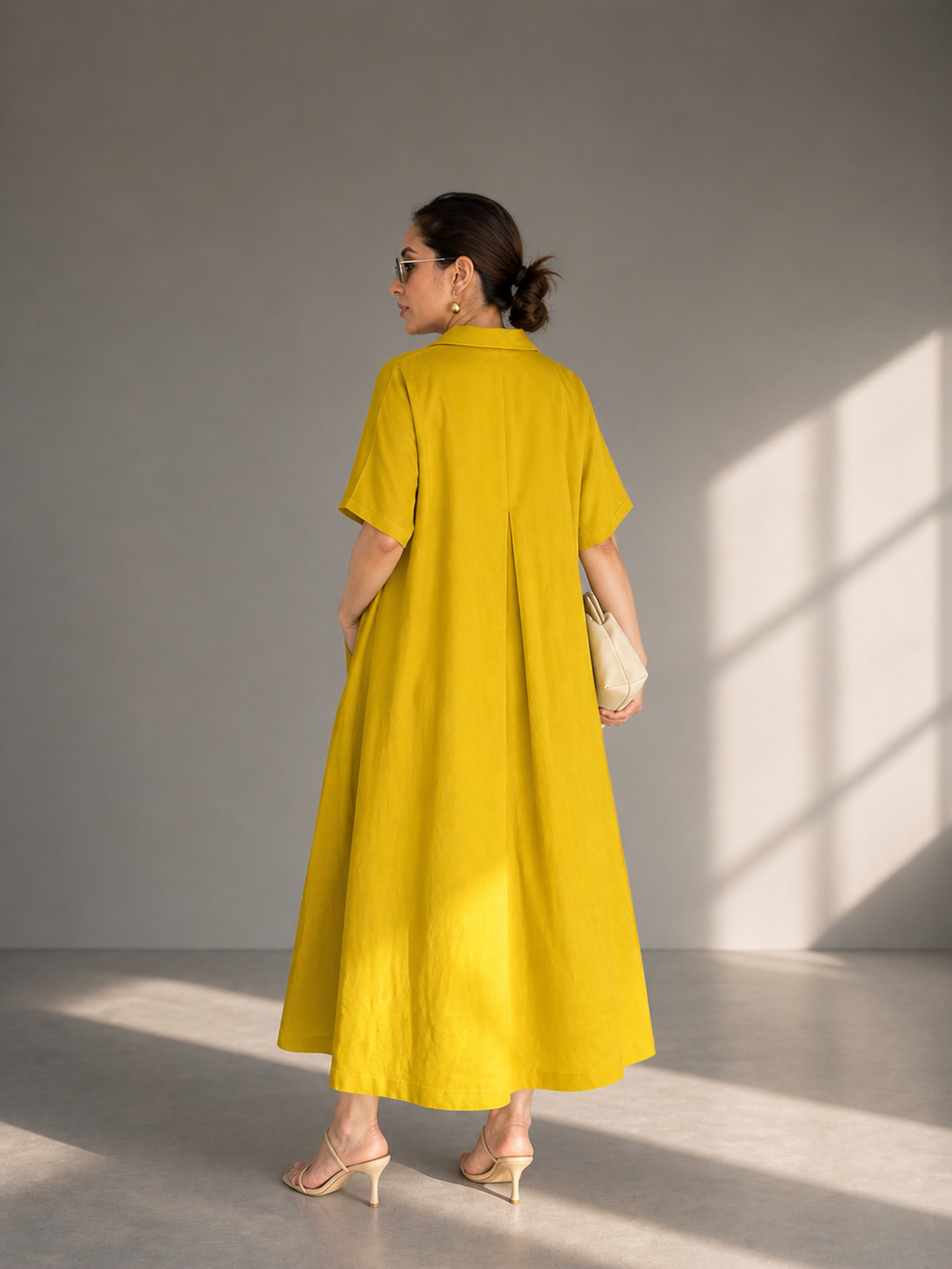     Back view of yellow flowy summer maxi dress