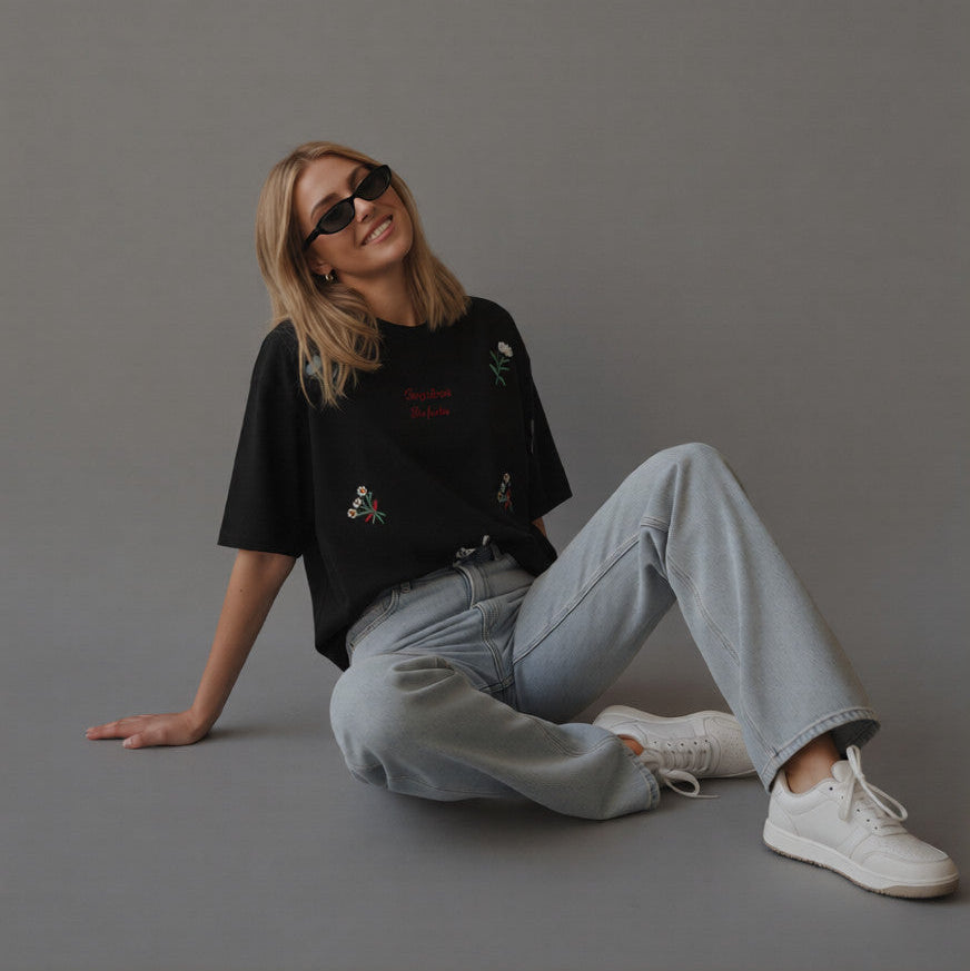 Black oversized t-shirt with scattered embroidered motifs
