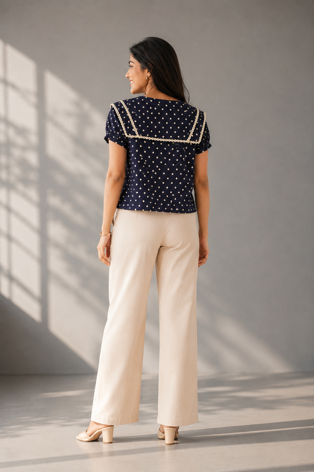 black polka dot top with plain back design and short sleeves