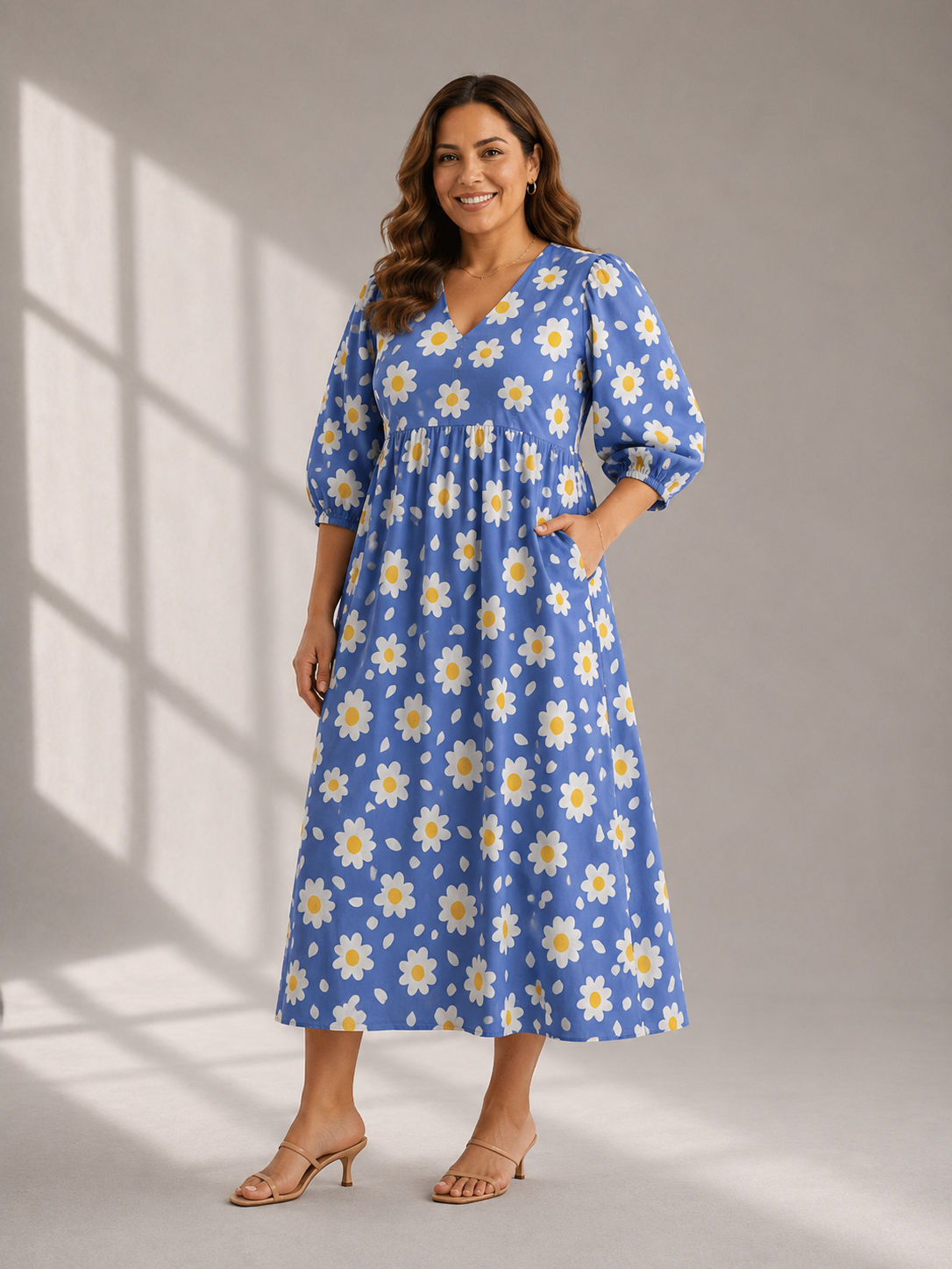 Woman wearing blue cotton midi dress with white daisy floral print front view