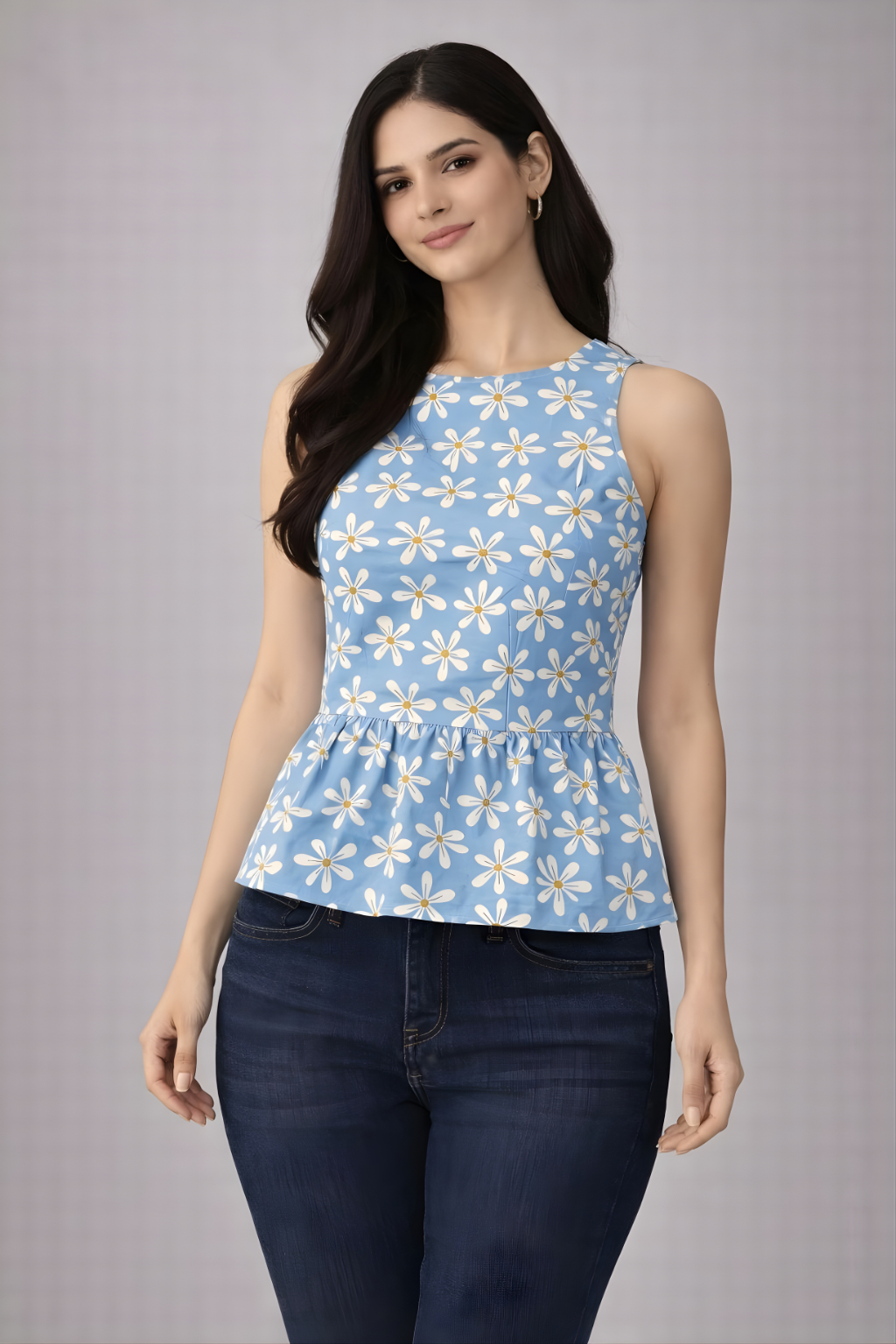 Woman wearing powder blue daisy print sleeveless peplum top styled with jeans