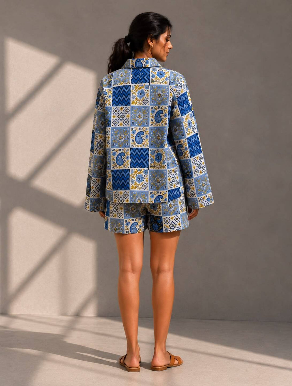 Women wearing blue printed shirt and matching shorts set