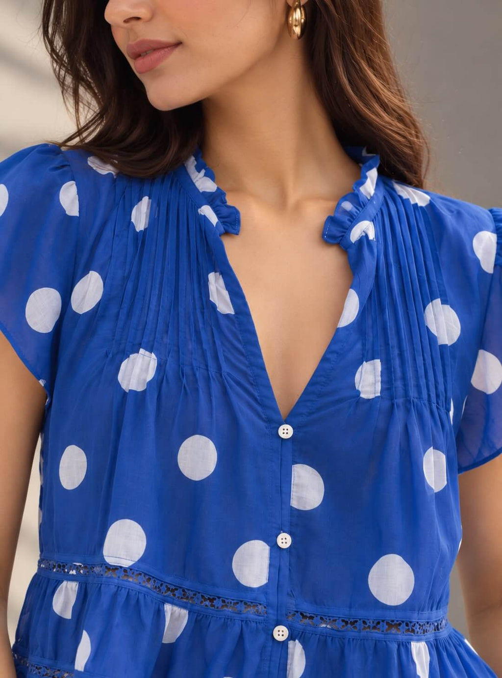 Women's blue polka dot top with gathered detailing