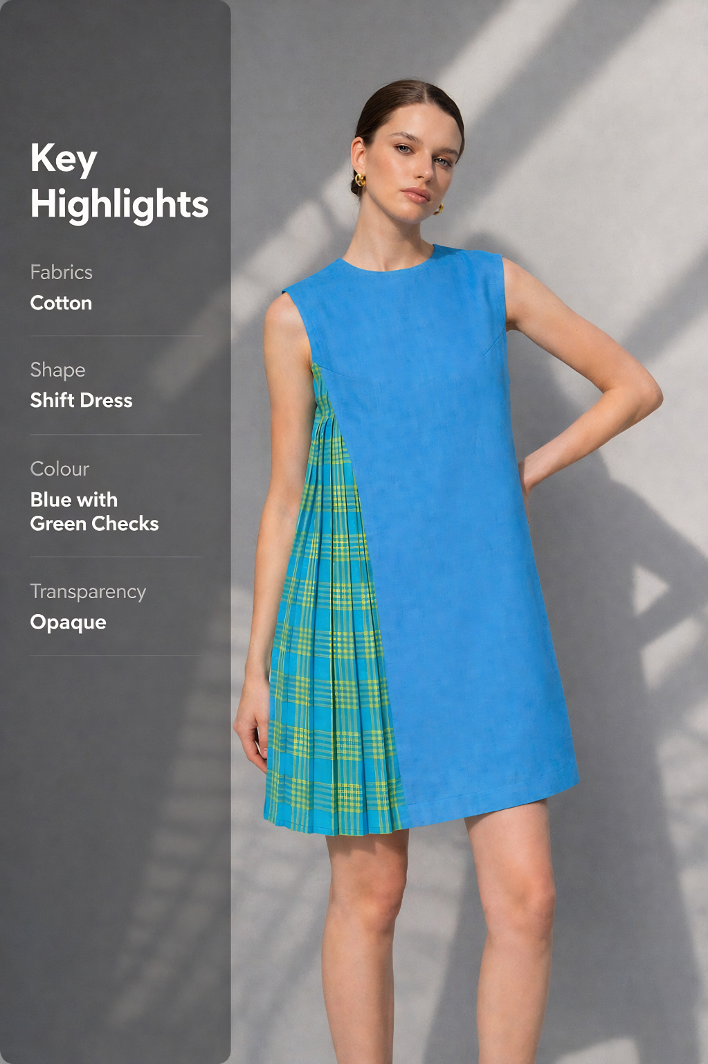 Woman wearing a blue dress with green plaid pattern 