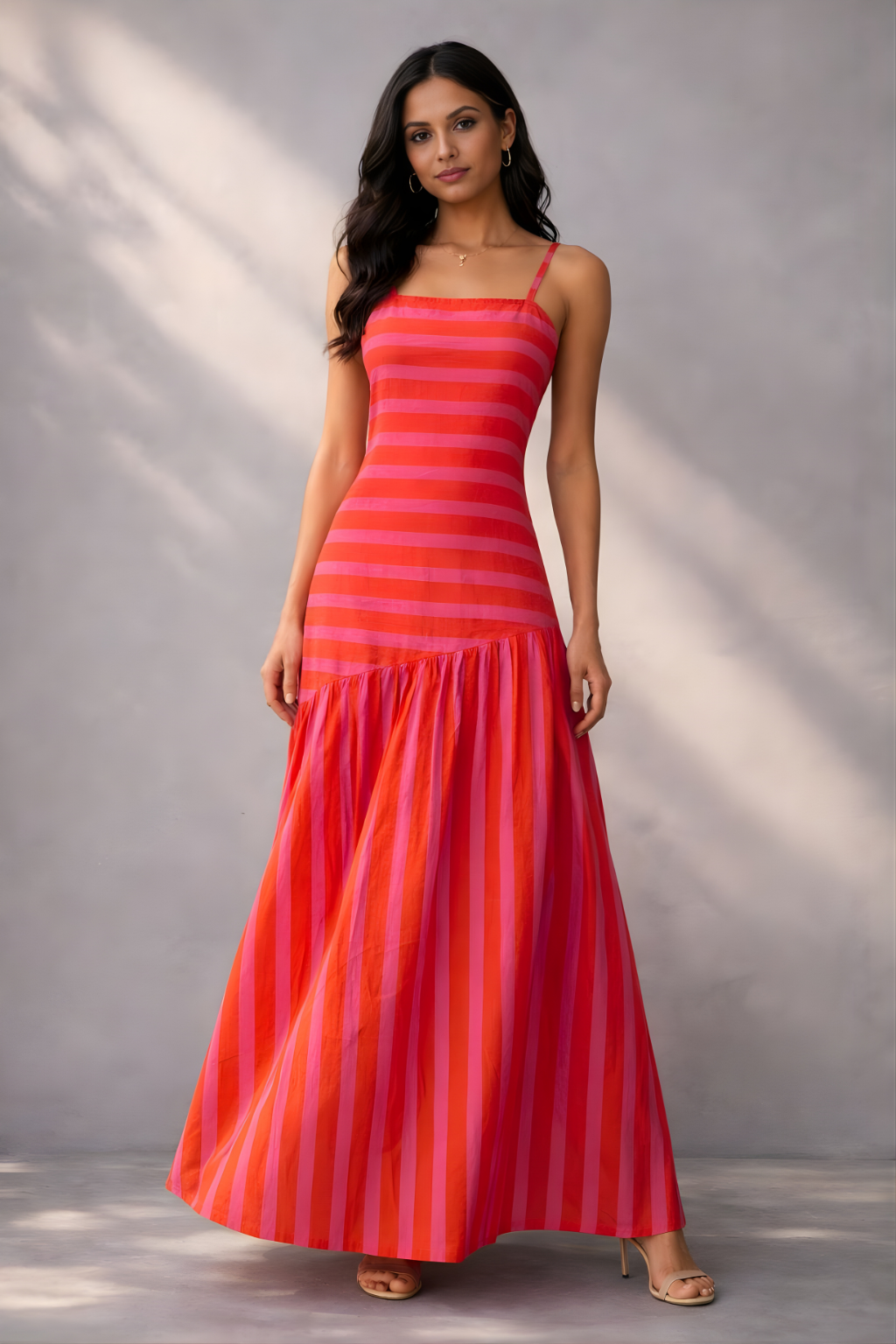 Pink and orange striped cotton maxi dress with fitted bodice and flowy hem