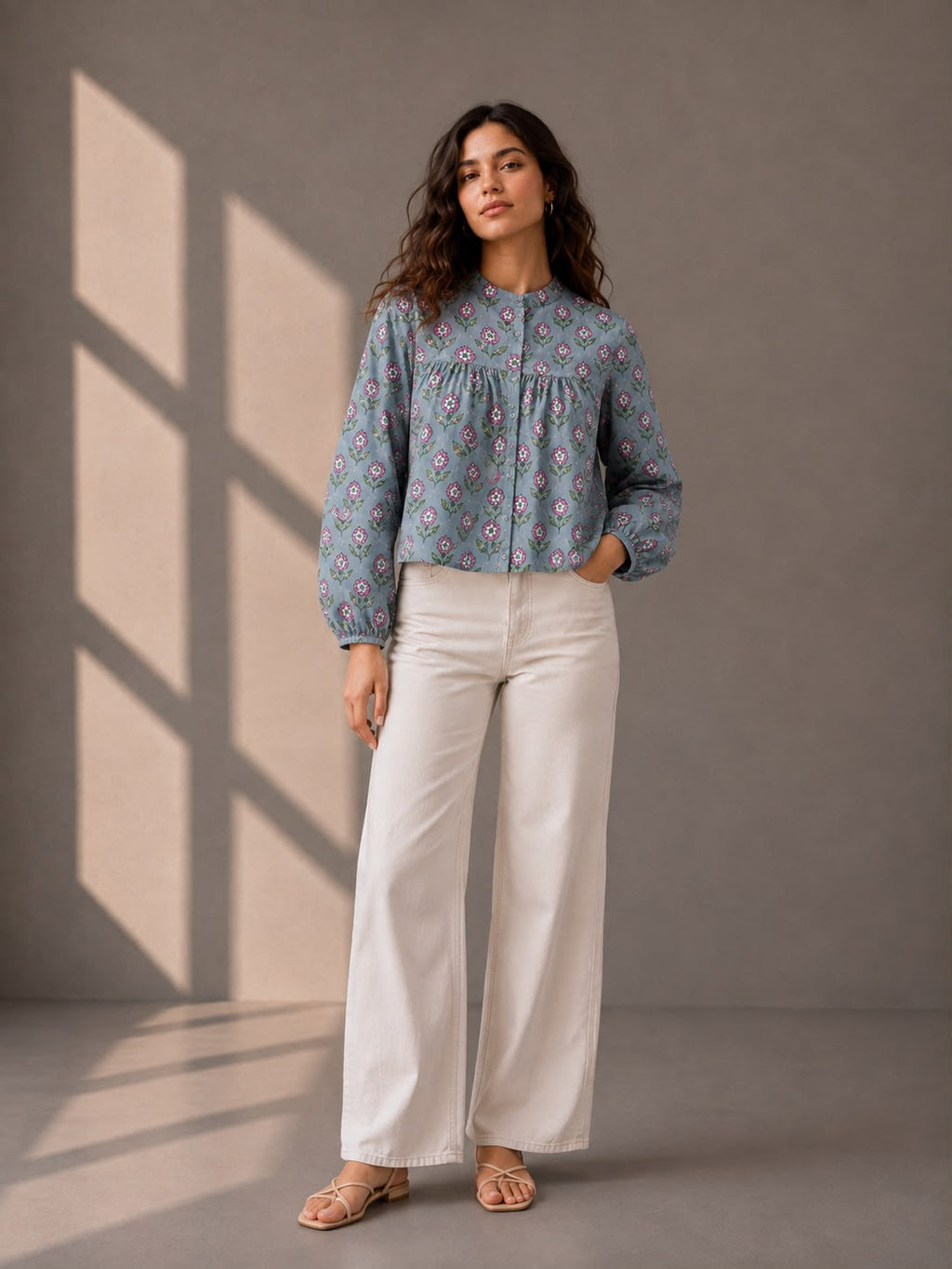 Dusty blue cotton top with pink floral print, gathered yoke detail, and full sleeves.