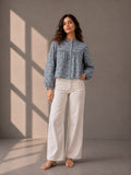 Dusty blue cotton top with pink floral print, gathered yoke detail, and full sleeves.