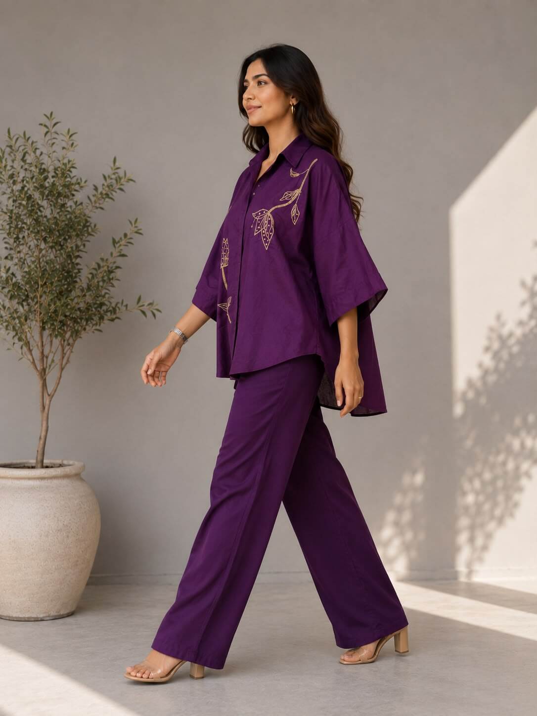 Relaxed-fit purple cotton shirt with botanical embroidery paired with matching cotton trousers.