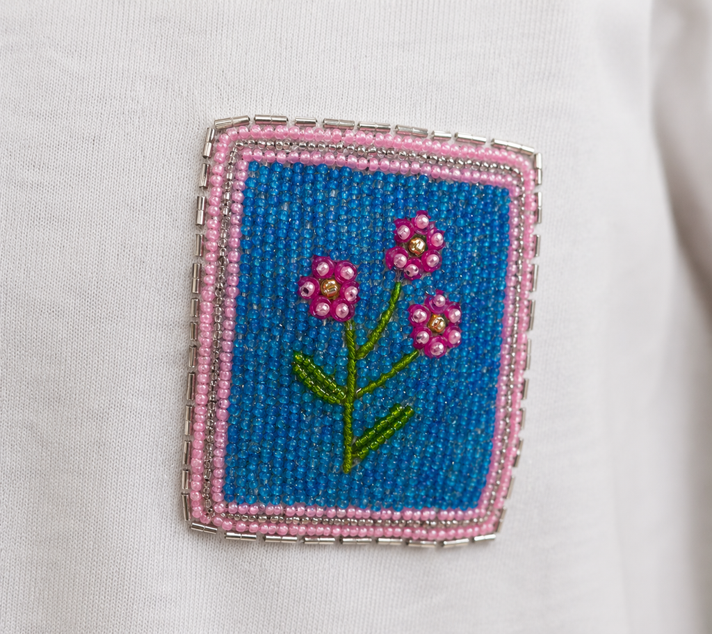 Minimal white tee with colorful beaded flower detail