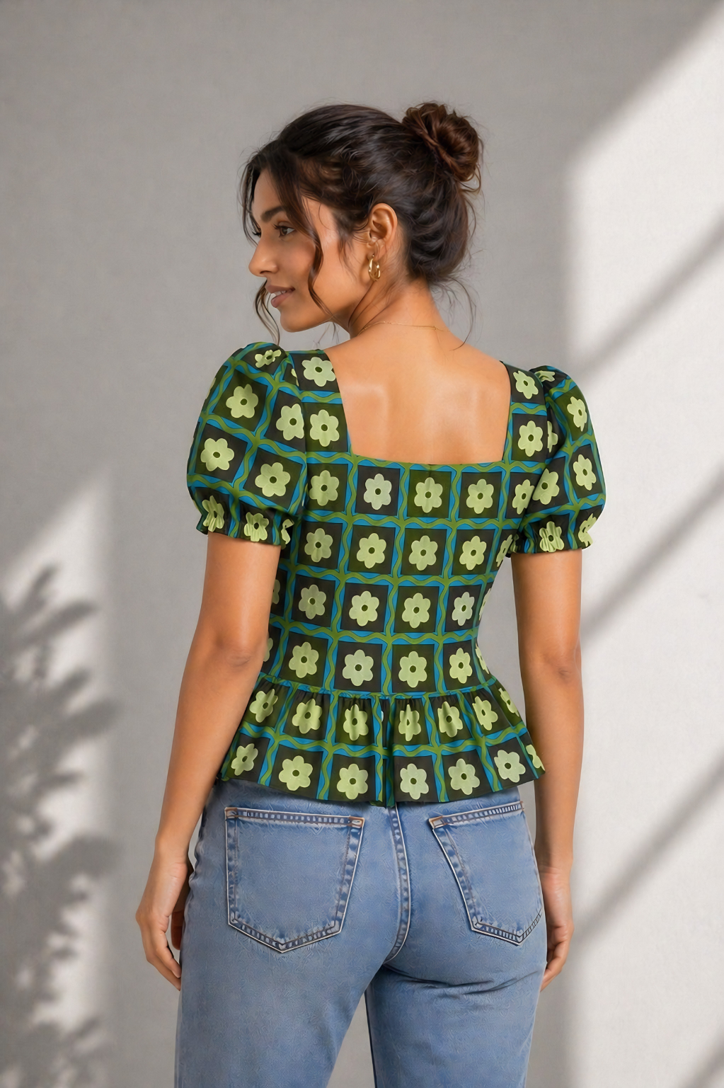 Close-up of floral check print on green cotton top
