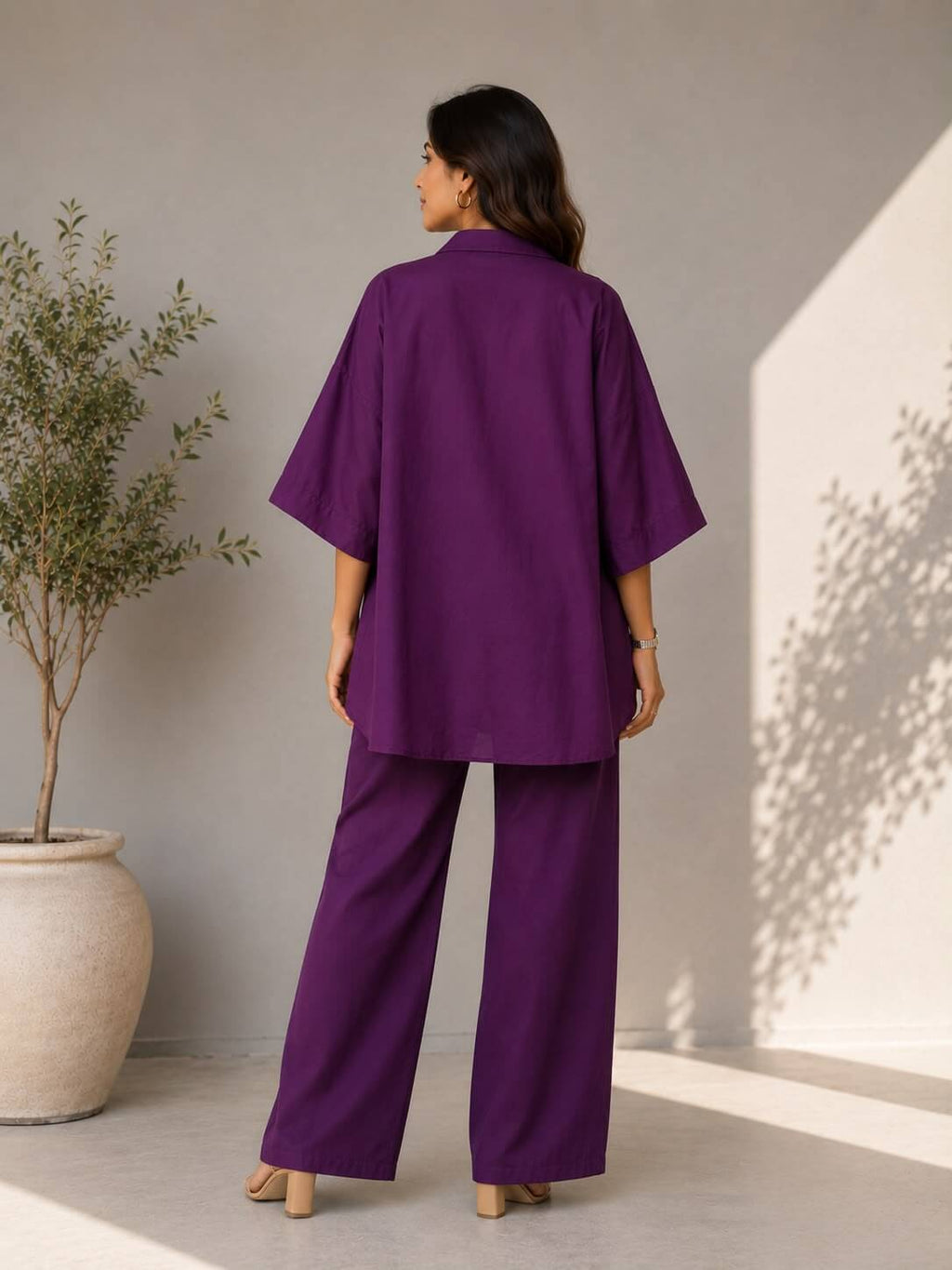 Premium purple cotton co-ord set featuring embroidered floral motifs and wide-leg pants for elegant everyday wear.