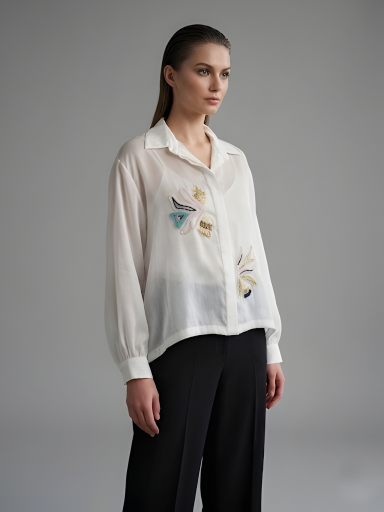 Elegant women’s ivory shirt with intricate handwork detailing