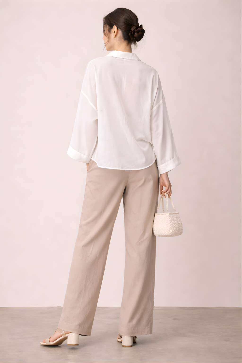 Elegant ivory crepe embroidered shirt styled with neutral trousers