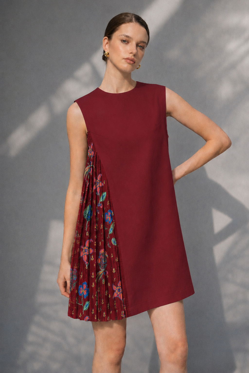 Woman wearing maroon floral pleated panel shift dress front pose