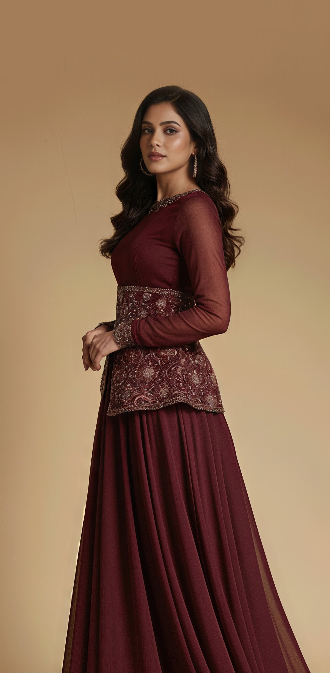 Woman wearing a maroon traditional outfit with intricate detailing on a beige background