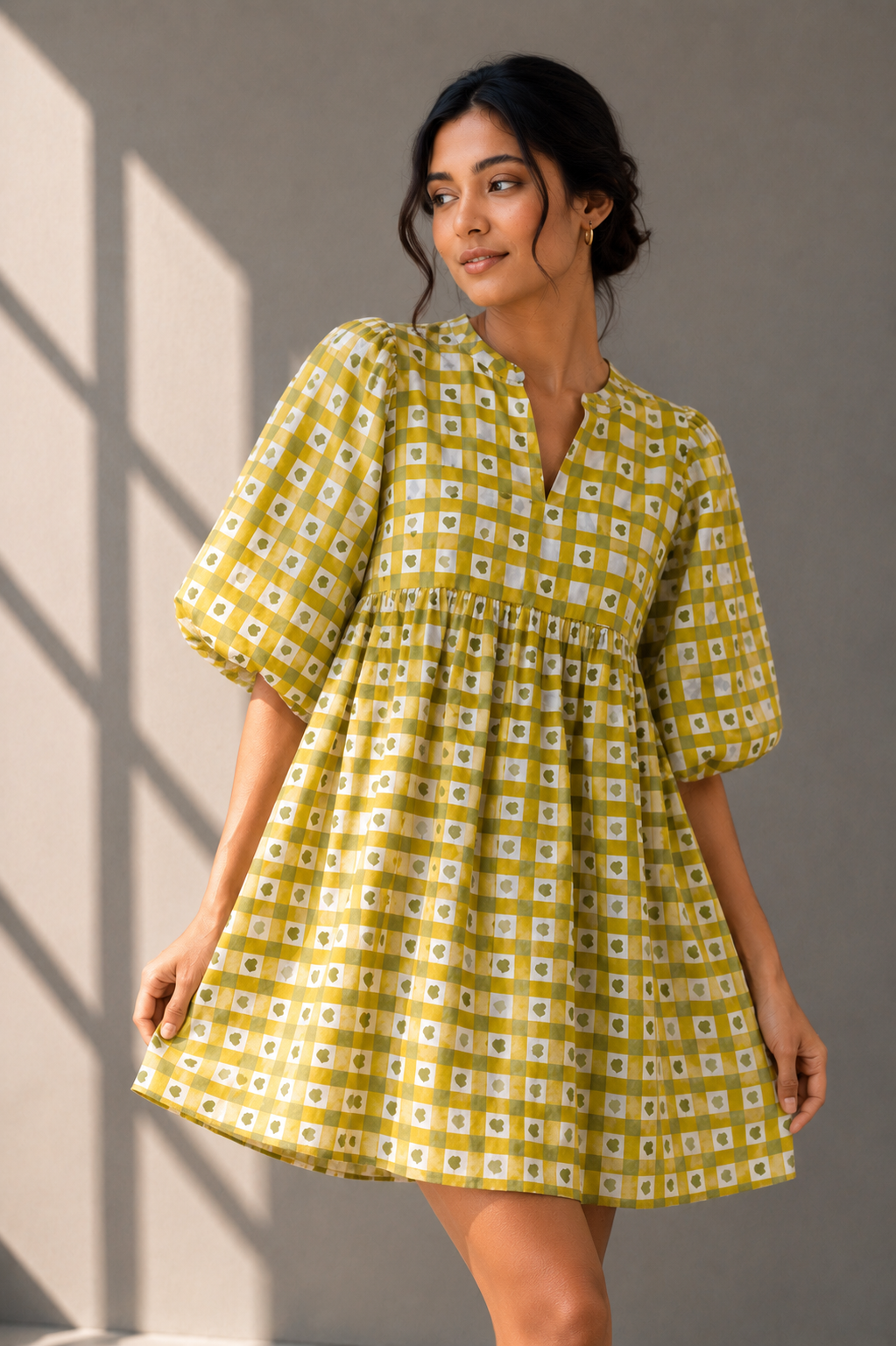 Close-up fashion portrait of olive gingham heart print babydoll dress with soft sunlight studio shoot