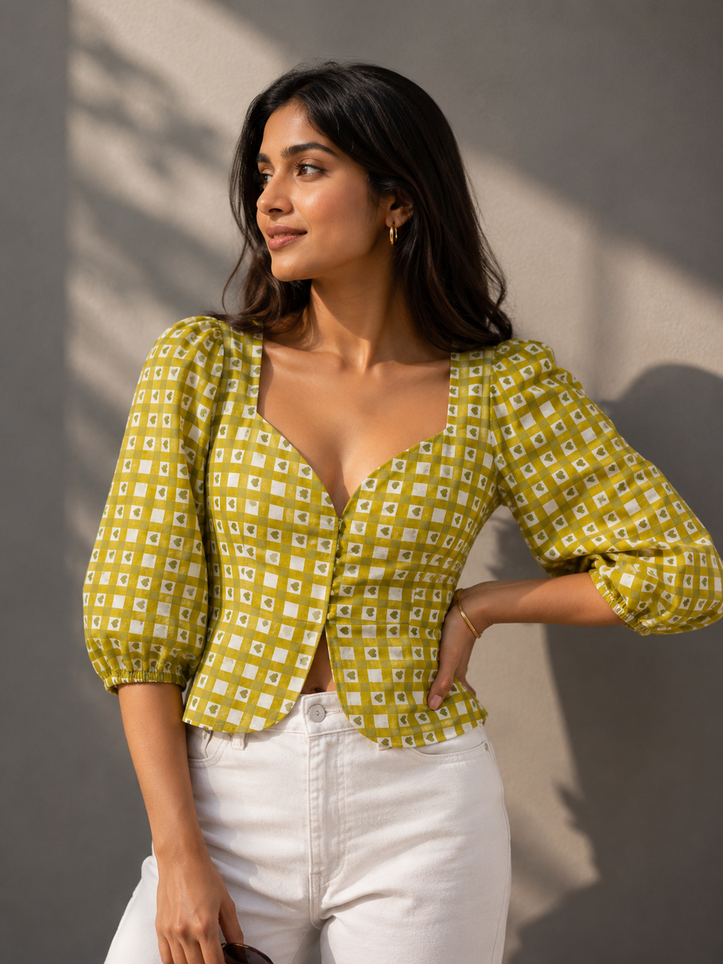 Close-up detail of sweetheart neckline and puff sleeves