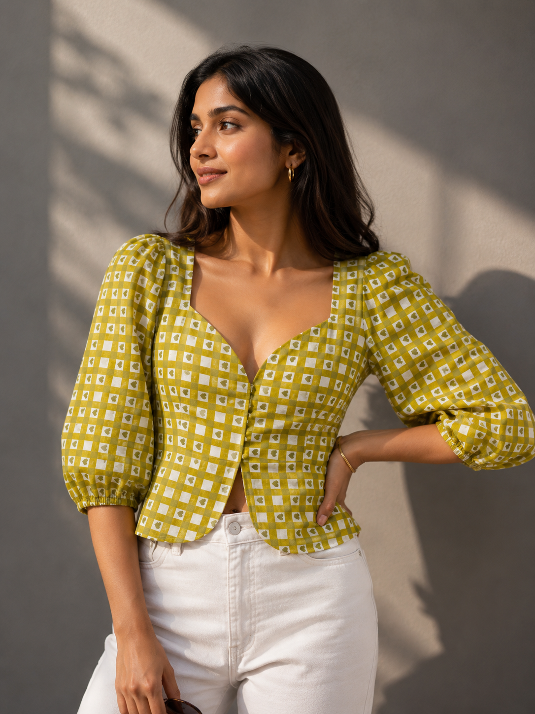Close-up detail of sweetheart neckline and puff sleeves