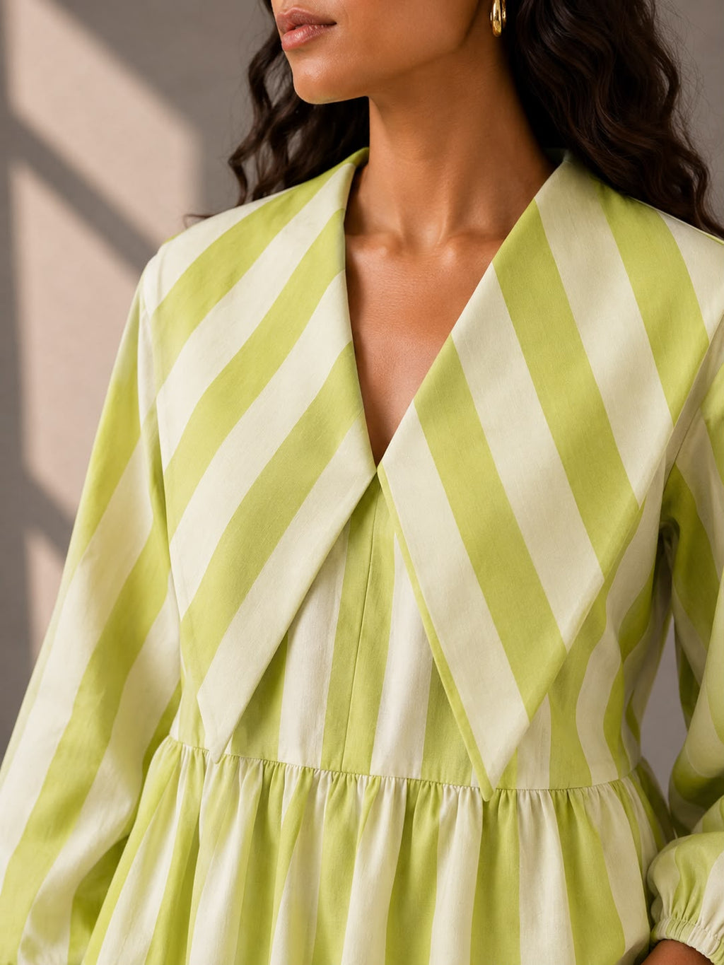 Cotton summer top with statement lapel collar and lime green vertical stripes.