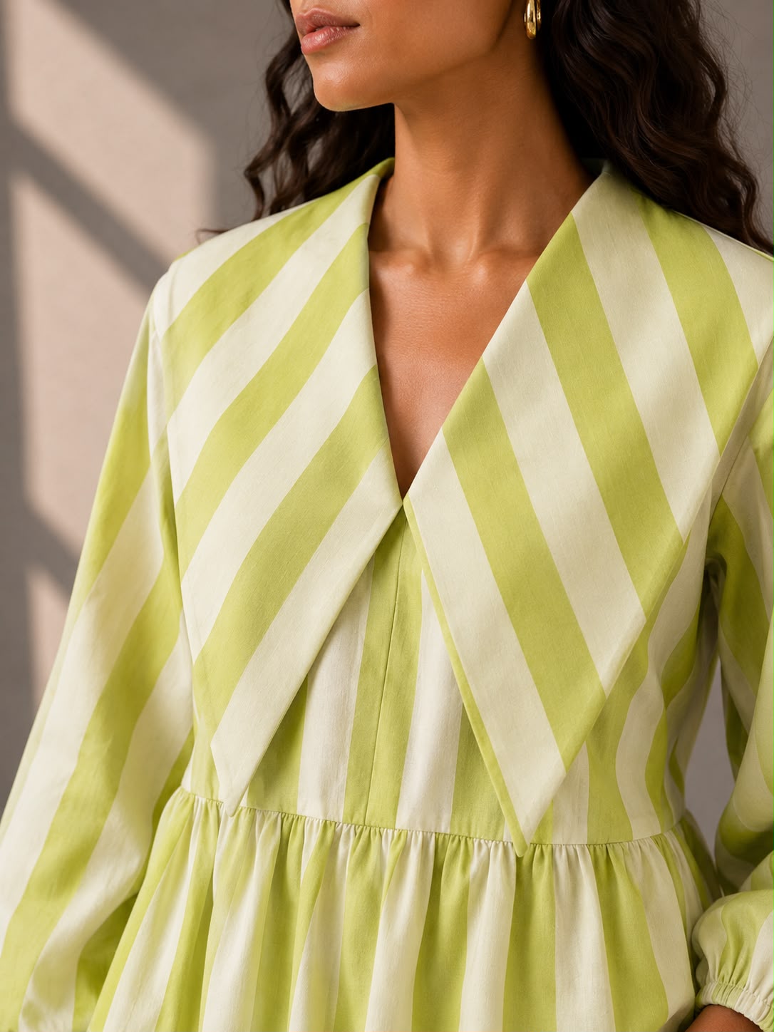 Cotton summer top with statement lapel collar and lime green vertical stripes.