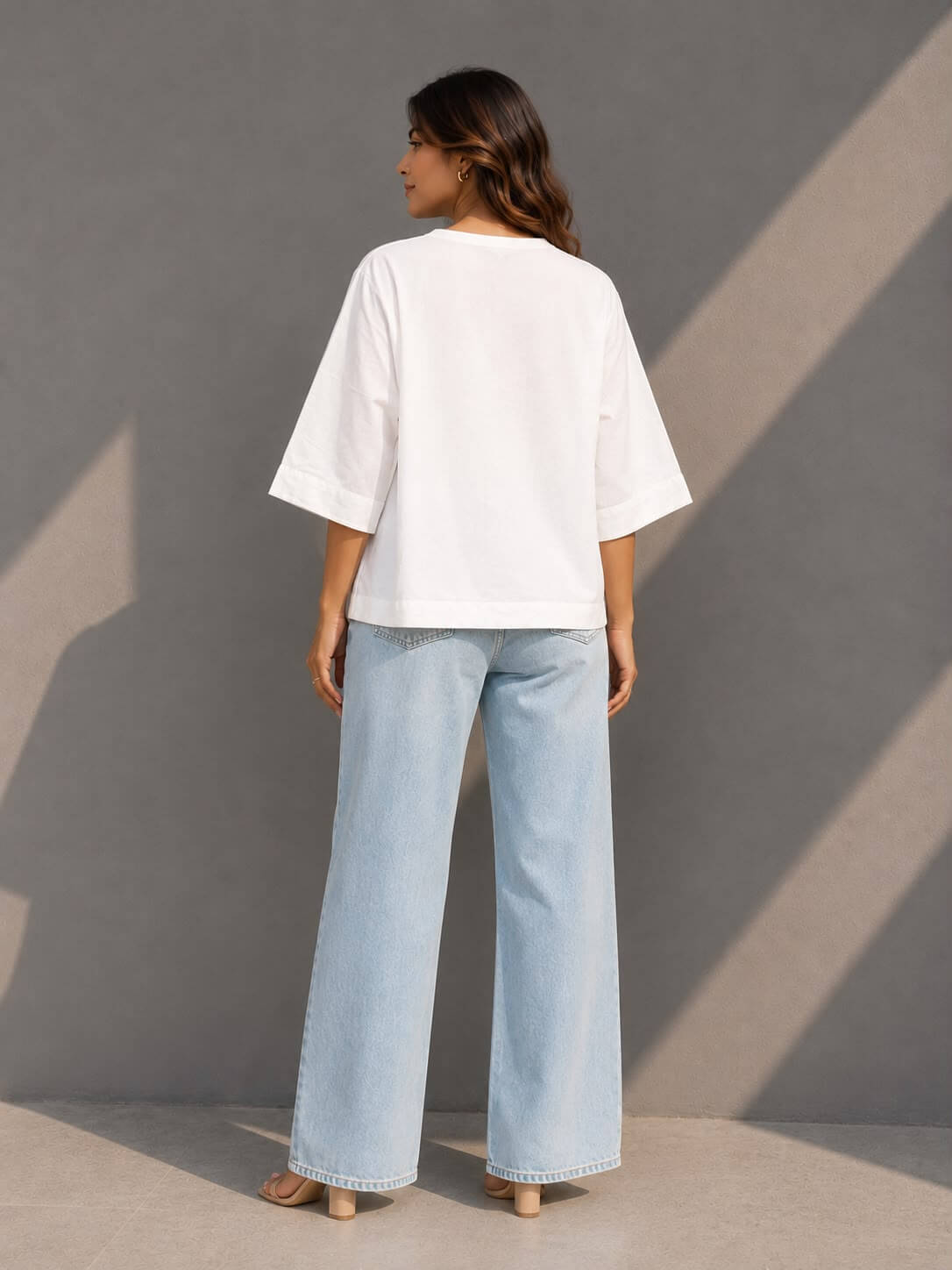 Oversized white cotton top with handcrafted tie-dye patch detail, perfect for summer and casual styling.