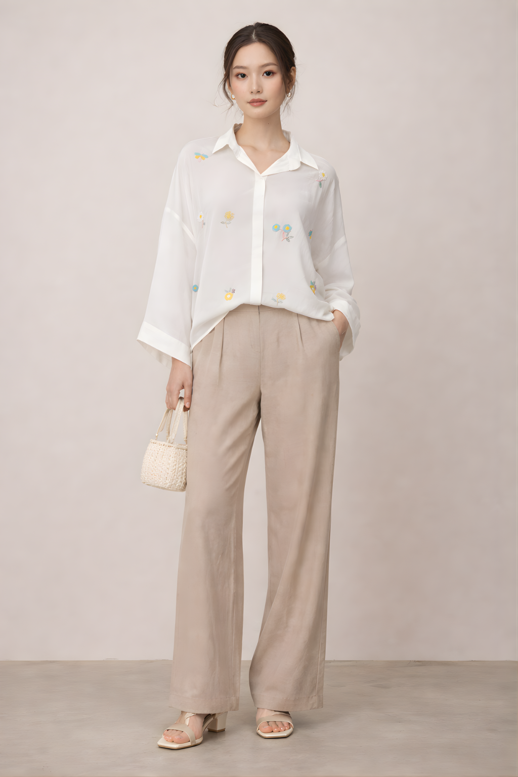 Women’s ivory crepe shirt with pearl floral embellishment