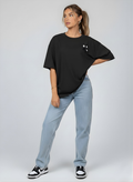 Relaxed fit black tee with delicate pearl flower detail