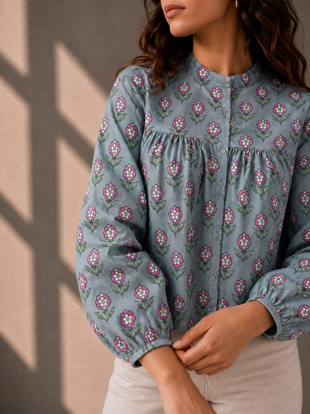Blue printed cotton top with balloon sleeves and delicate pink flower motifs