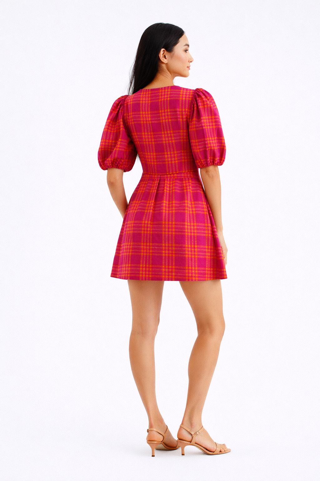 Close up of pink plaid puff sleeve mini dress fabric and neckline
