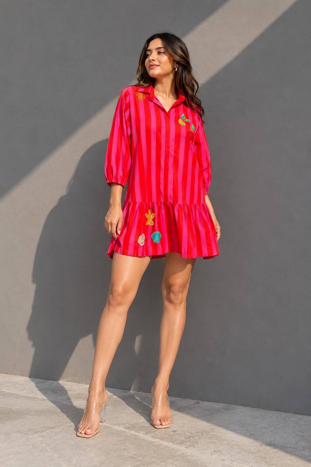 Pink and orange striped cotton shirt dress featuring handcrafted embellishments and a relaxed fit.