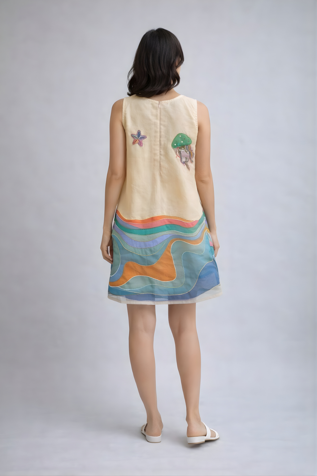Playful coastal-inspired mini dress with embroidered sea elements