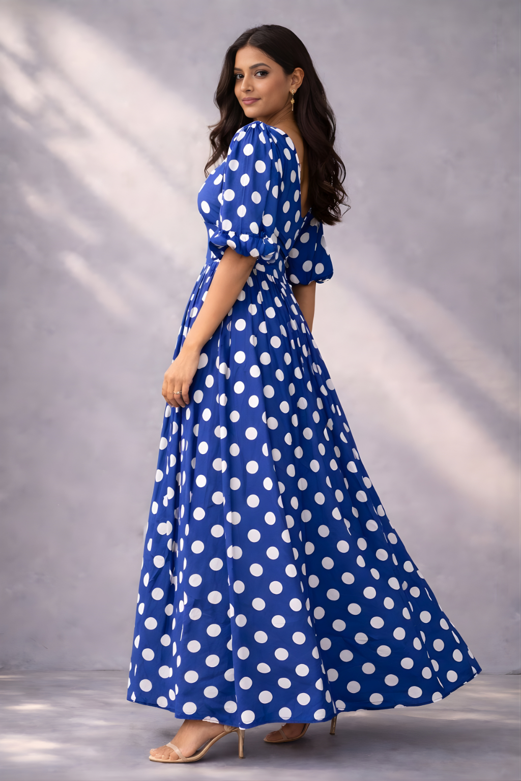 Flowy blue dress with white polka dots and button-down front 