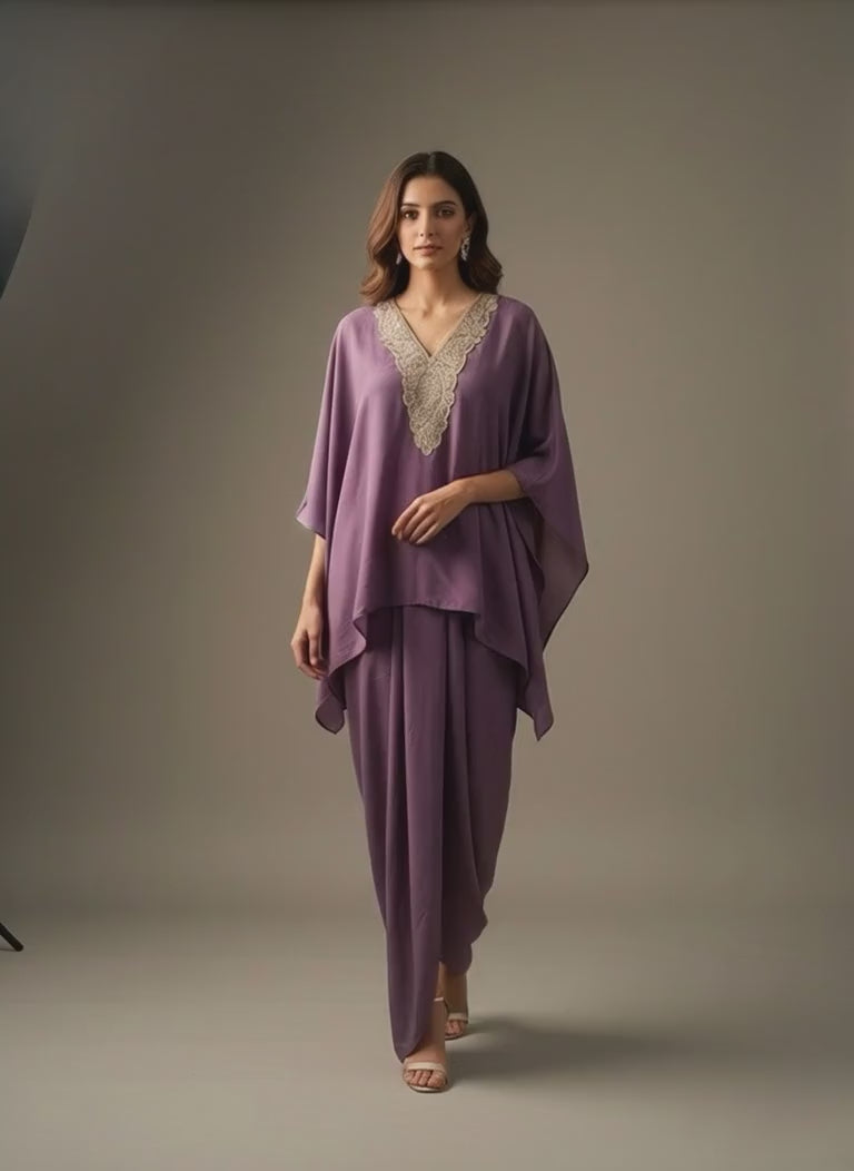 A woman wearing lavender Kaftan with skirt. Perfect for all occasion wear.
