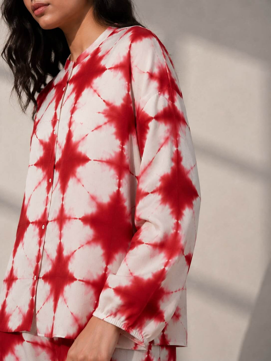 Handcrafted cotton tie-dye shirt and trouser co-ord set for women in red and ivory by Gehru Label.