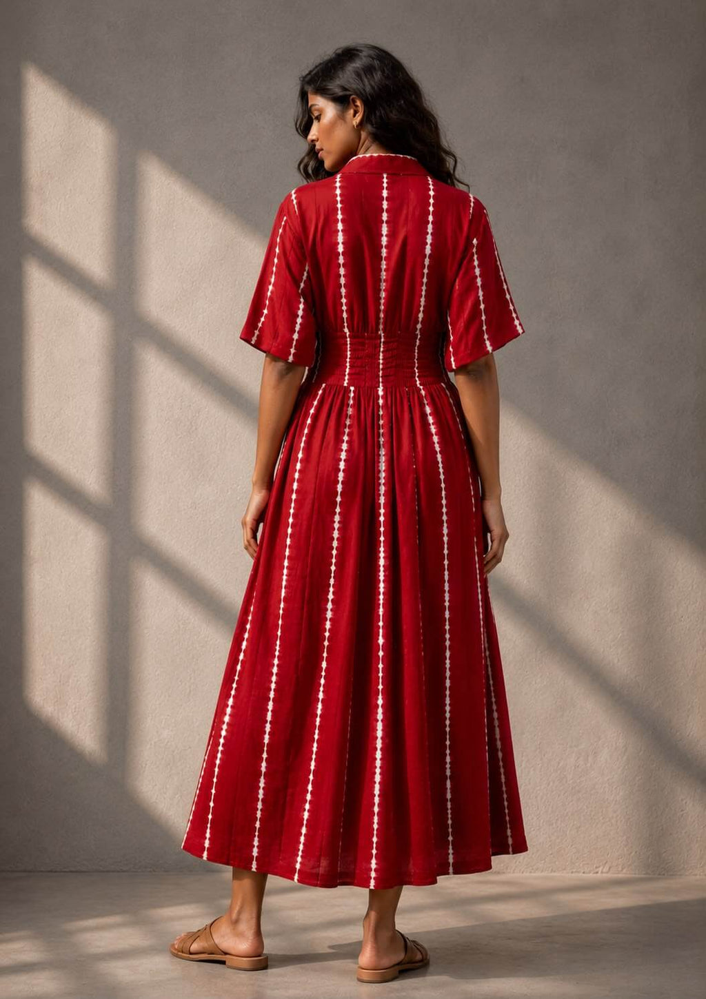 Handcrafted cotton Shibori dress for women with a button-front design and midi-length skirt by Gehru Label.