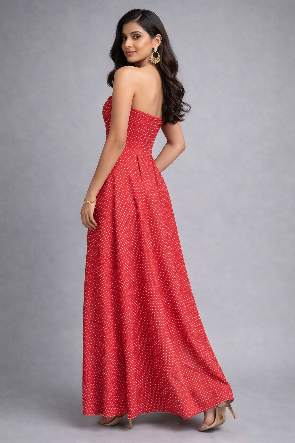 Woman wearing a red tube dress with detachable sleeves and side pockets