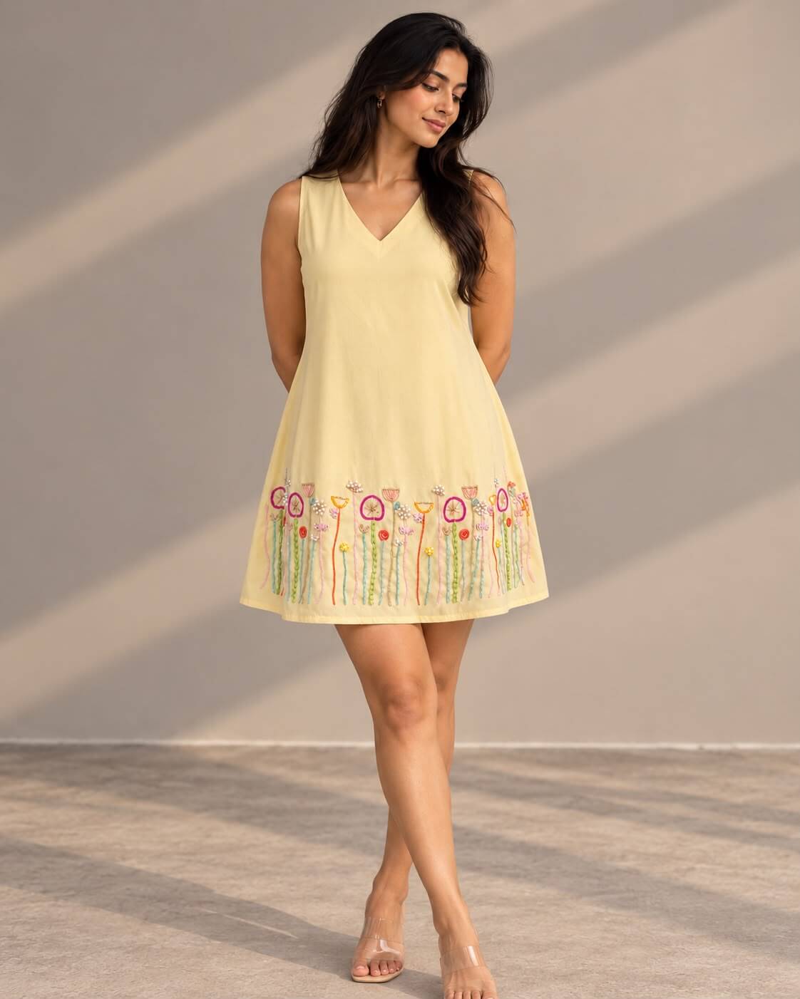 Yellow embroidered A-line dress with floral hem detailing