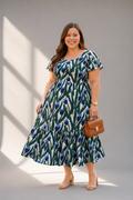 Front view of tulip block print cotton tiered midi dress for women
