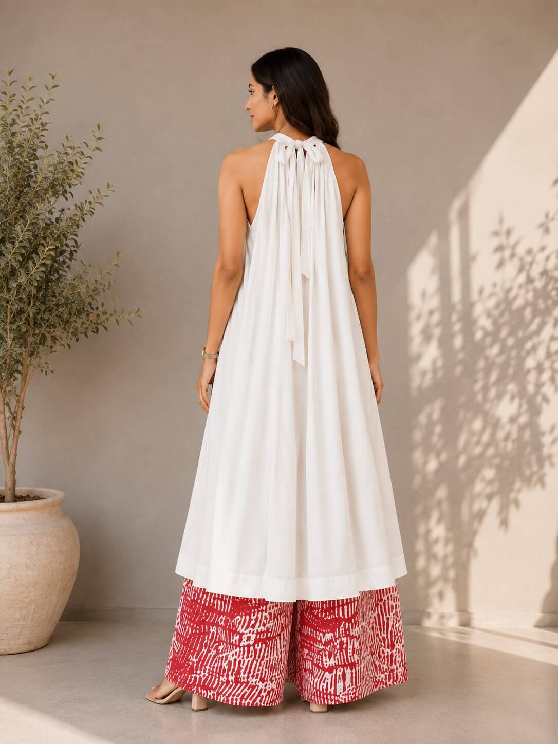Elegant white cotton kurta with cotton tie-dye palazzo trousers, perfect for summer and festive wear.