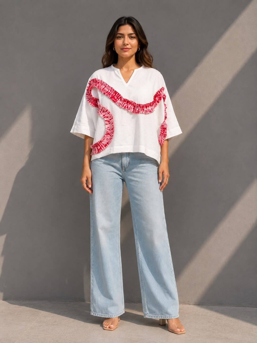 Women's white cotton top featuring handcrafted tie-dye patch detailing and a relaxed fit.
