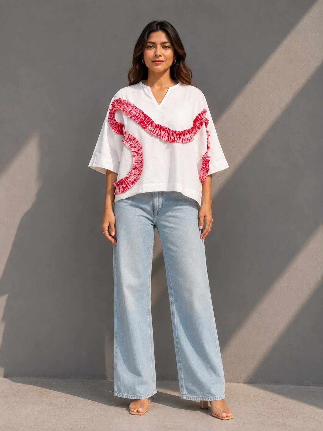Women's white cotton top featuring handcrafted tie-dye patch detailing and a relaxed fit.