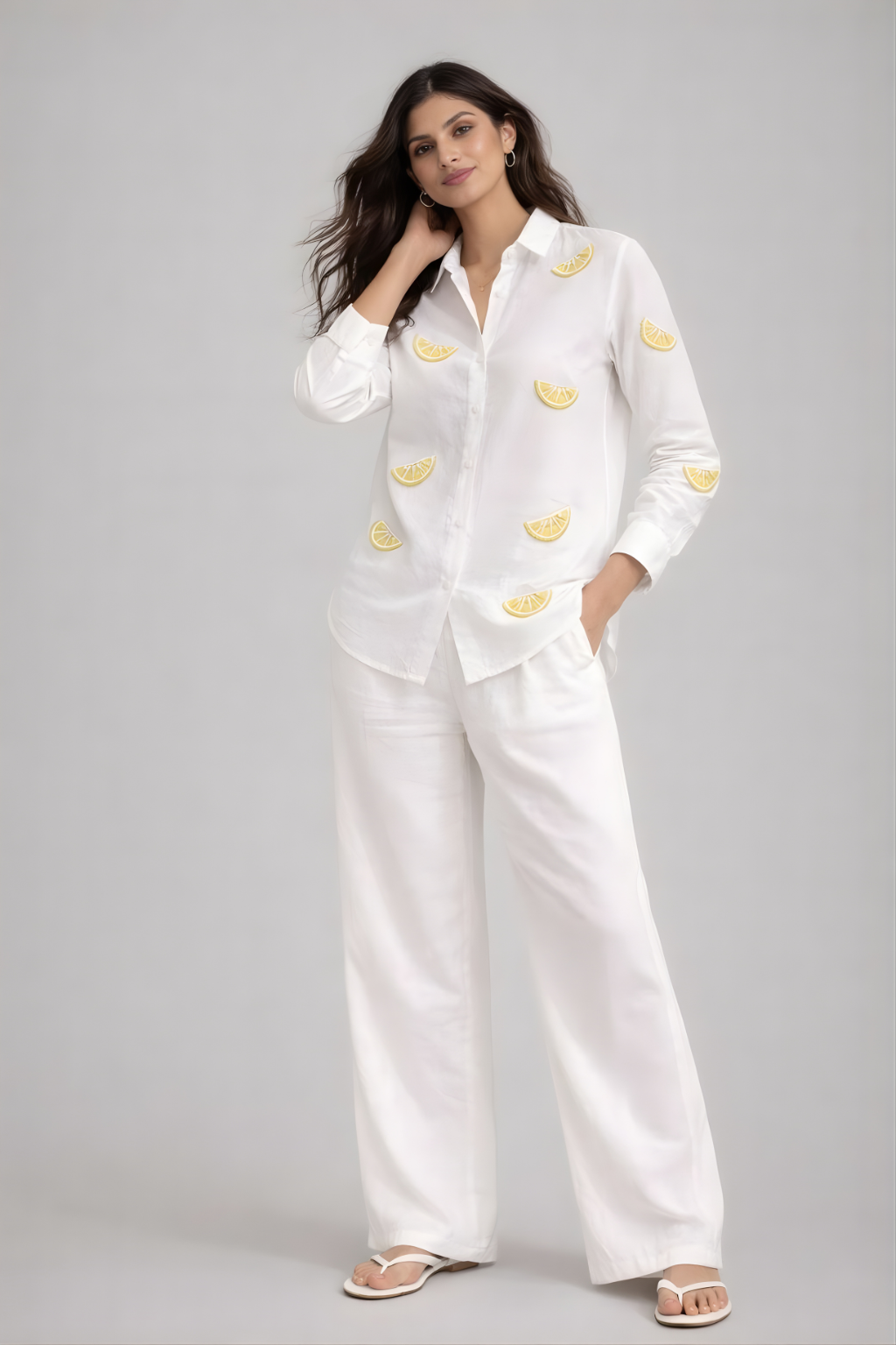 Women’s white shirt with lemon pearl embroidery styled with white trousers