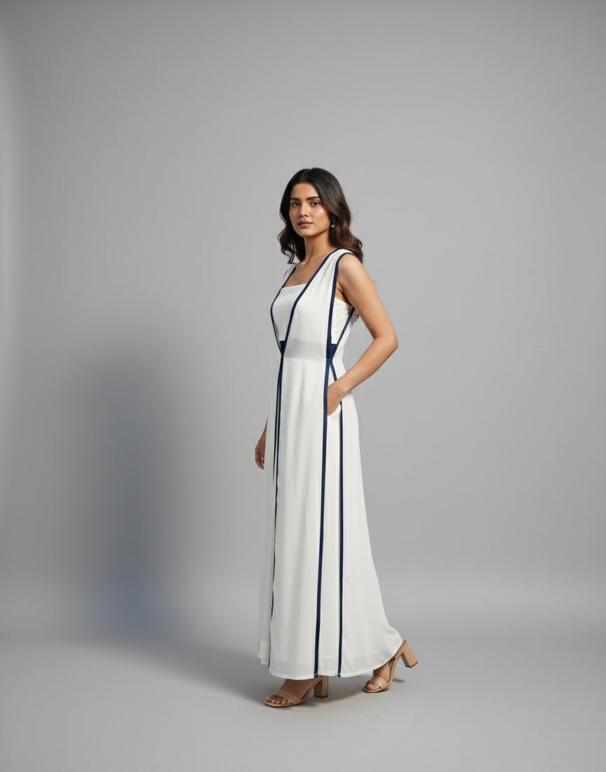 Woman wearing a white dress with black straps on a gray background