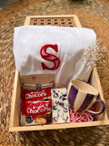 Gehru Keepsake Box featuring a customized alphabet T-shirt, handcrafted Rakhi, purple striped ceramic mug, rose petal fragrance bar, Choco Pie, and premium wooden gift box